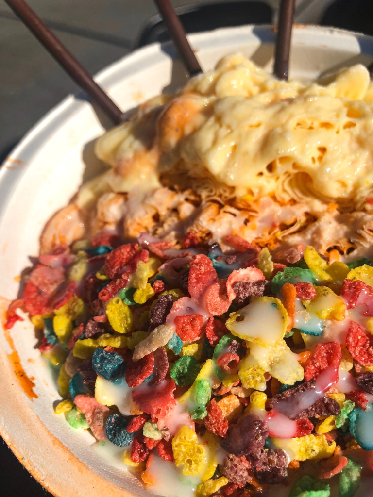 Peach and Thai Tea Snocream topped with Fruity Pebbles, pocky, and condensed milk. Snocream is a hybrid of ice cream and shaved ice. It's from SnoCream Company, which is located in Annandale, Virginia.