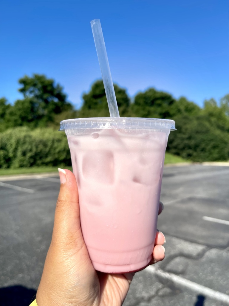 A hand holding a summer drink called "Cherry Cloud" from PJ's Coffee in Bowie, Maryland.