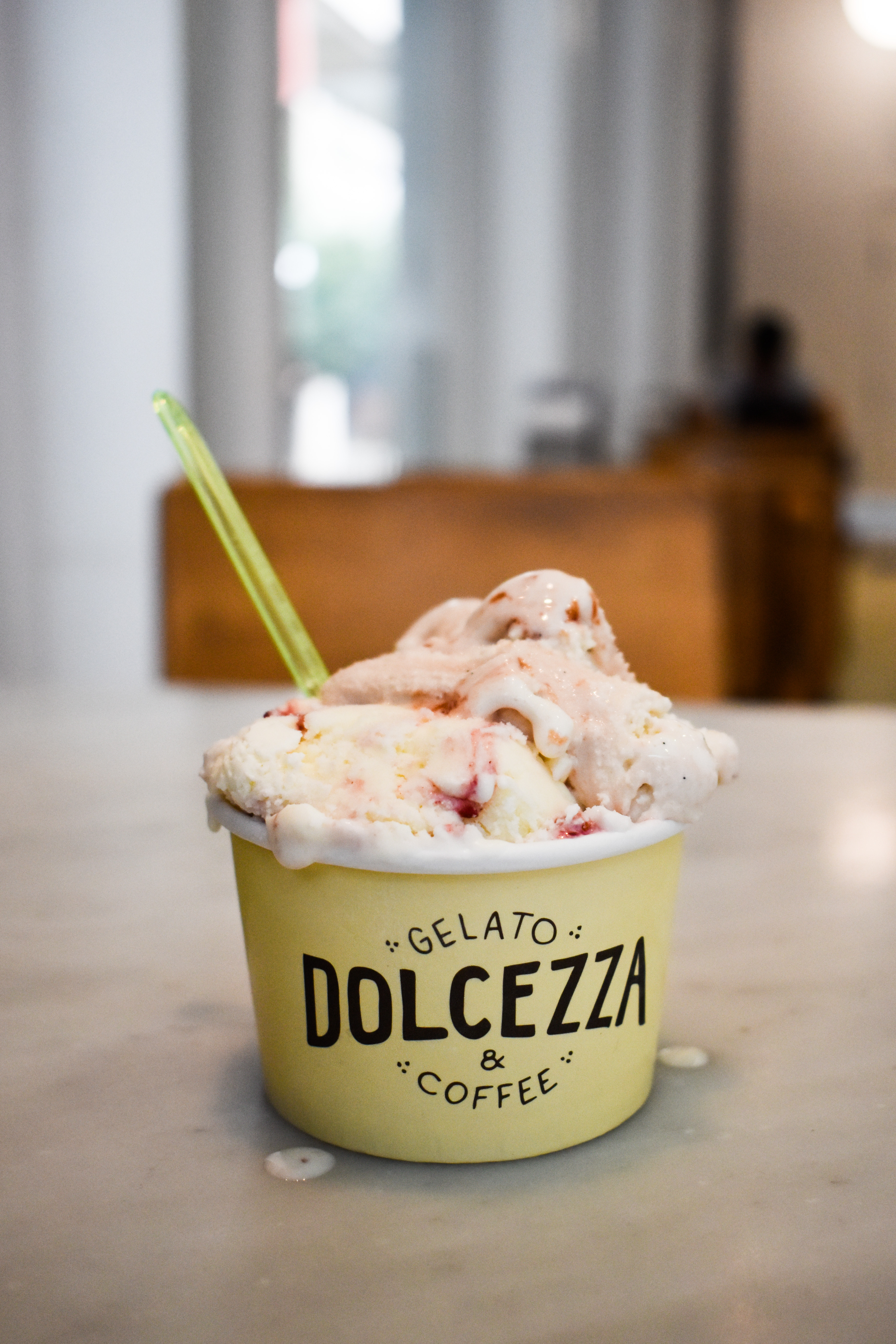 A bowl of Dolcezza Gelato's Mascarpone and Fig gelato sitting on a table